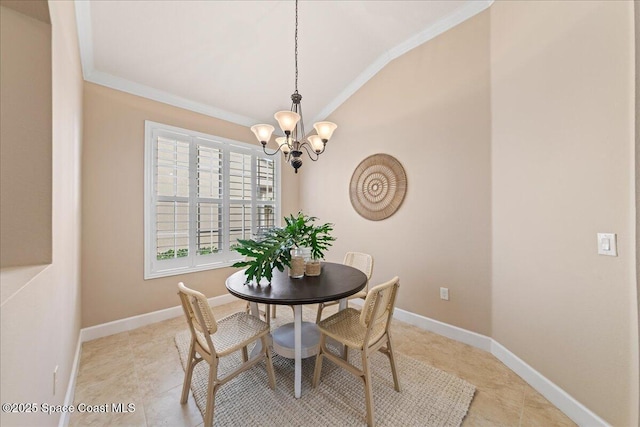 tiled dining area with an inviting chandelier and ornamental molding