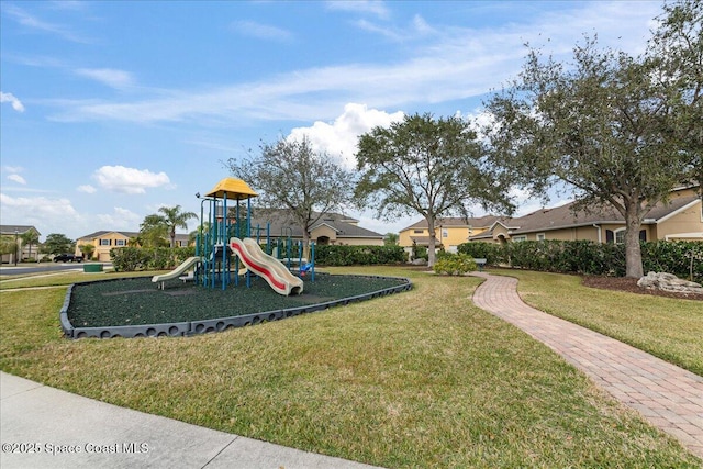 view of playground with a lawn