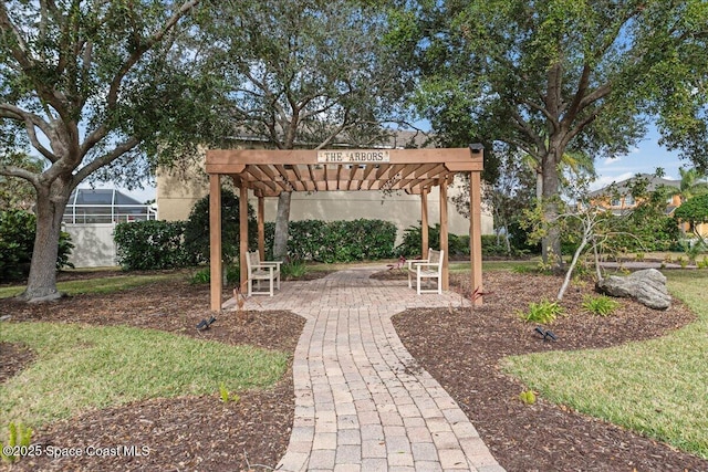 view of yard with a pergola, glass enclosure, and a patio