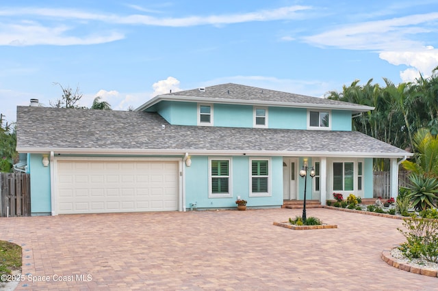 view of front of property with a garage and covered porch