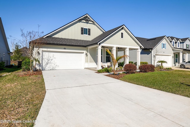 view of front of house featuring a front lawn and a garage