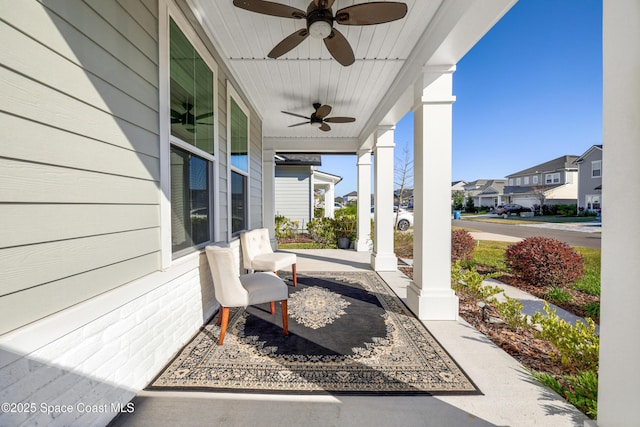 view of patio / terrace with ceiling fan and a porch