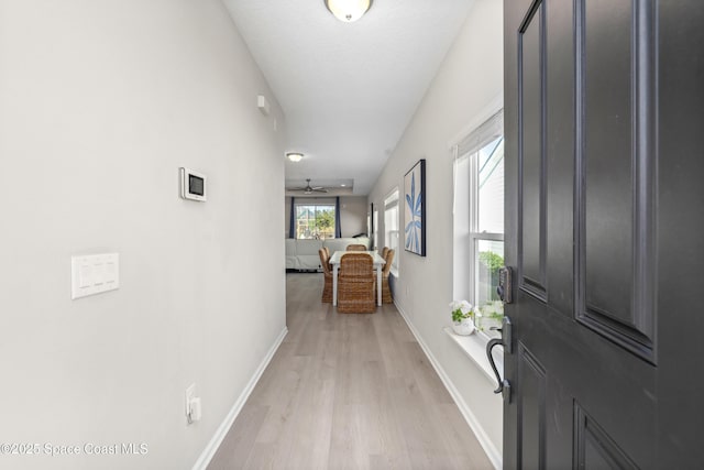 hallway with light wood-type flooring