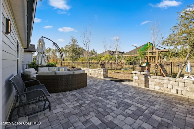 view of patio / terrace with an outdoor living space and a playground