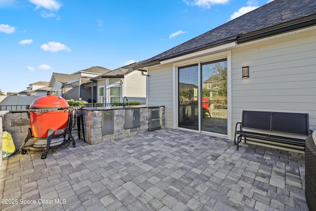 view of patio / terrace featuring exterior kitchen