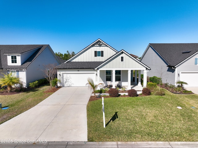 modern farmhouse with a porch, a garage, and a front lawn