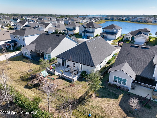 drone / aerial view featuring a water view