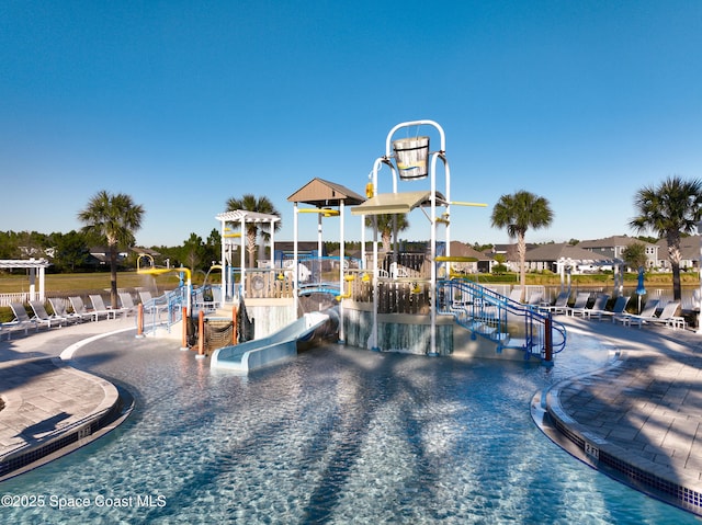 view of pool with a water slide