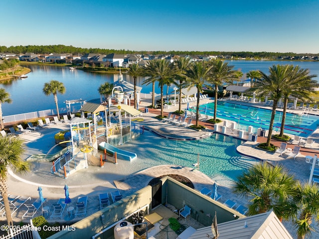 view of swimming pool featuring a water view and a water slide