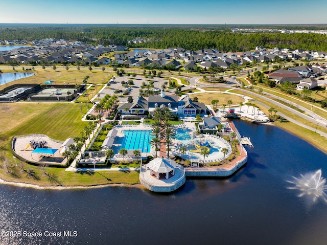 birds eye view of property with a water view