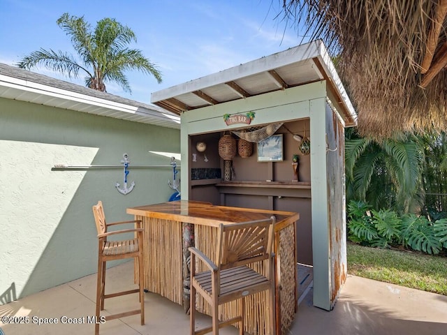 view of patio with a bar