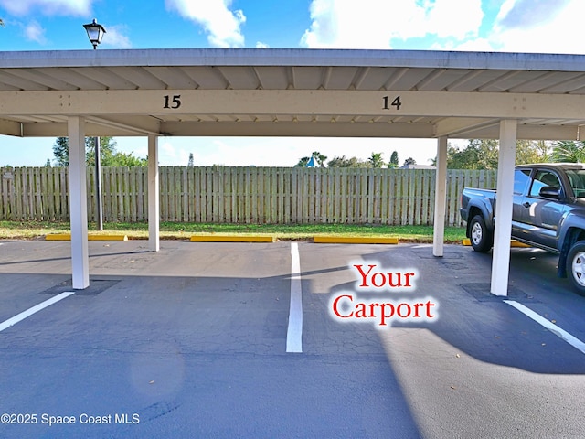 view of parking / parking lot with a carport