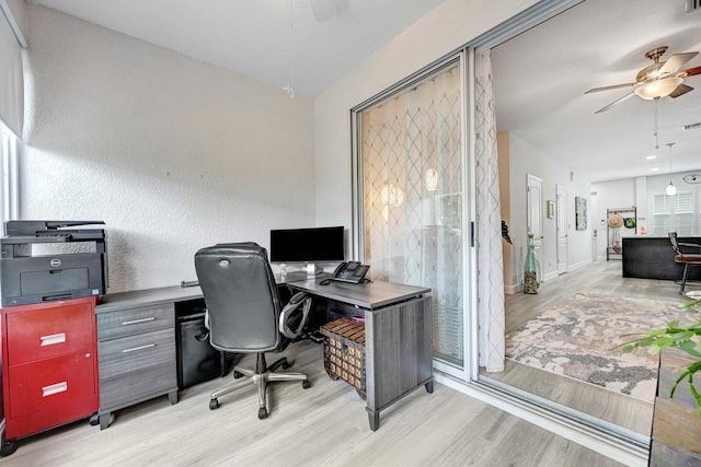 home office featuring ceiling fan and light wood-type flooring