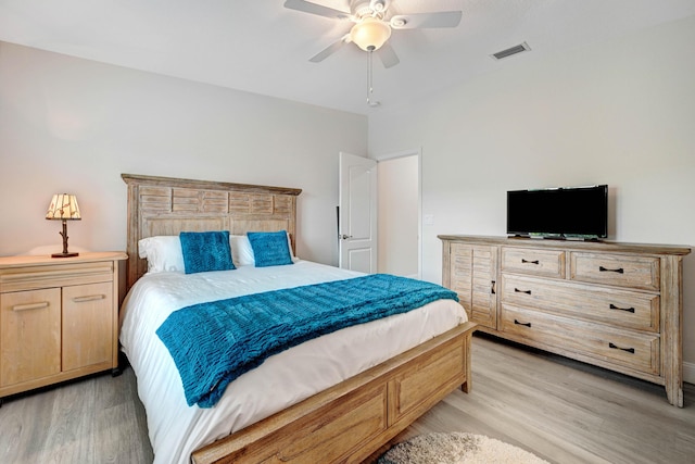 bedroom with ceiling fan and light wood-type flooring