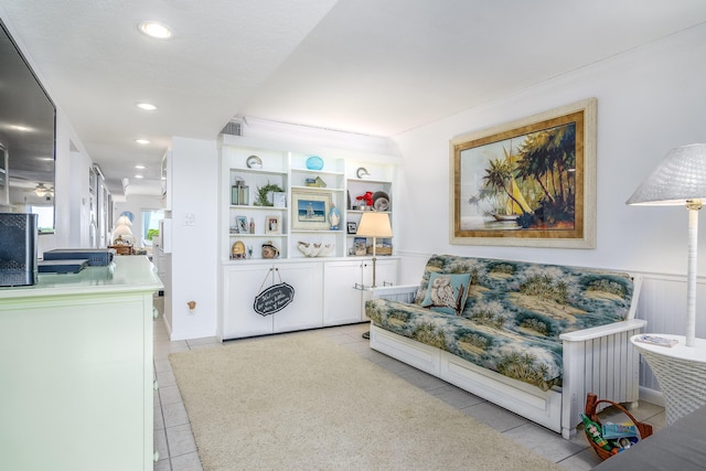 living room featuring radiator and light tile patterned flooring