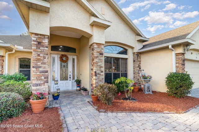 doorway to property featuring a garage