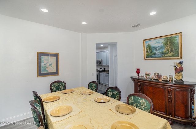 dining area featuring wood-type flooring