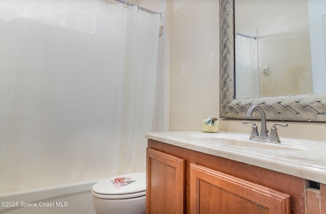 bathroom featuring toilet, a shower with curtain, and vanity