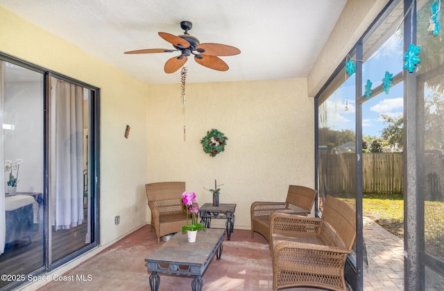 sunroom / solarium with ceiling fan