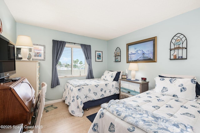 bedroom with light wood-type flooring