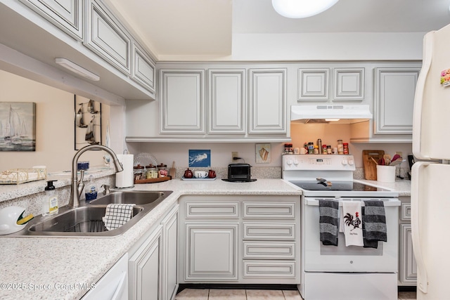 kitchen with premium range hood, sink, light tile patterned flooring, and white appliances