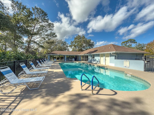 view of swimming pool with a patio