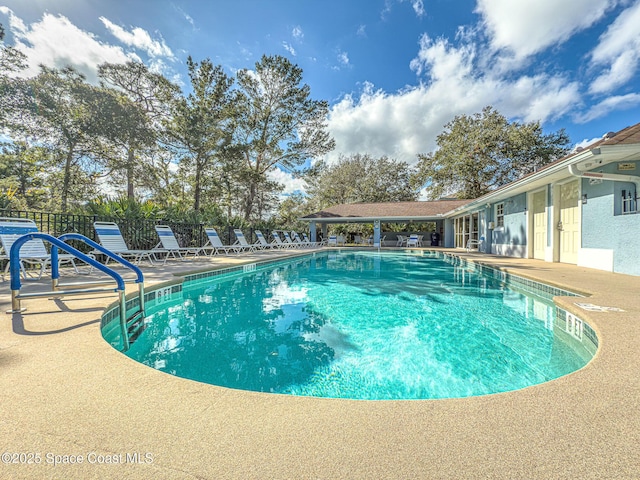 view of pool featuring a patio area