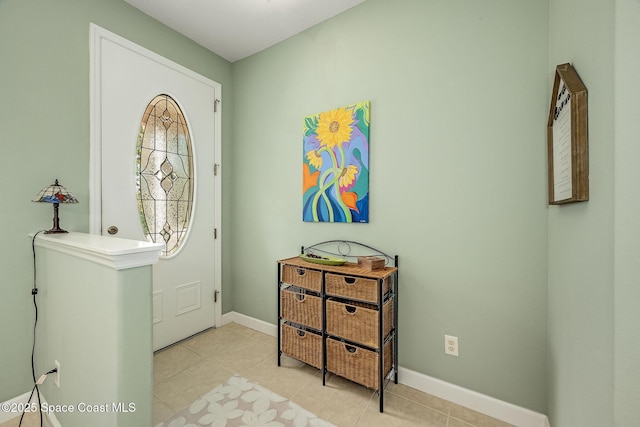 entrance foyer featuring light tile patterned floors