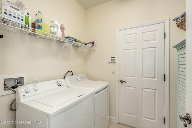 washroom featuring independent washer and dryer