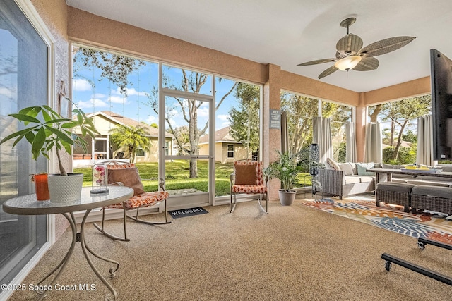 sunroom / solarium with ceiling fan