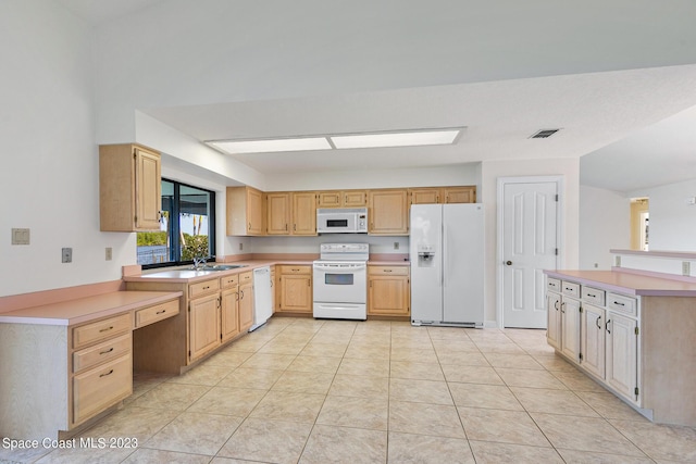 kitchen with light brown cabinets, white appliances, sink, and light tile patterned floors