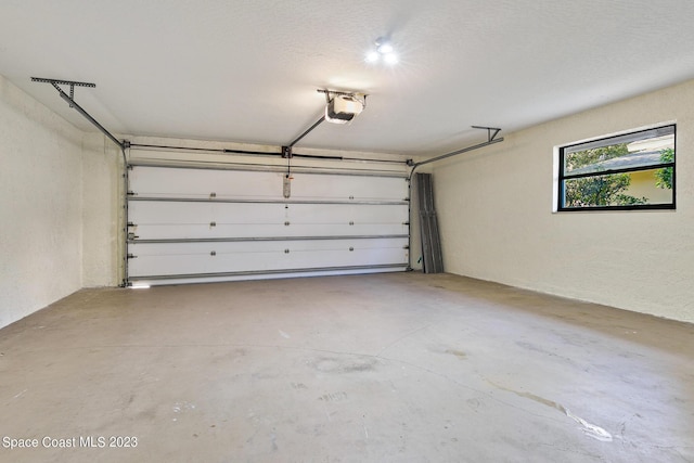 garage featuring a garage door opener