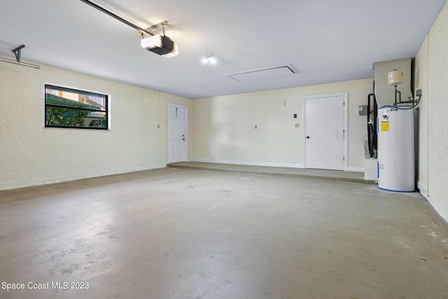 garage featuring a garage door opener and water heater