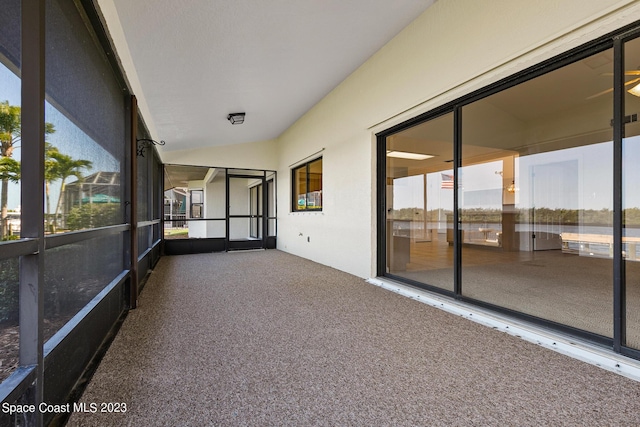 unfurnished sunroom with vaulted ceiling