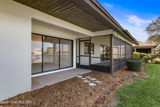 exterior space featuring a sunroom