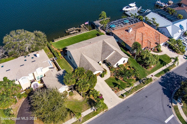 birds eye view of property with a water view