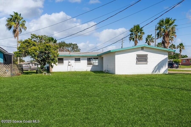 rear view of house with a lawn