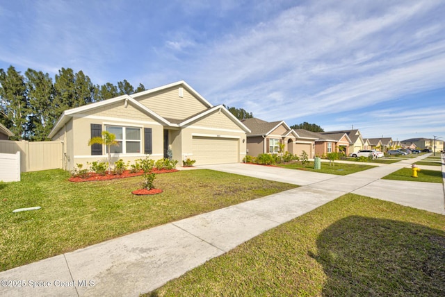 view of front of property featuring a front lawn and a garage