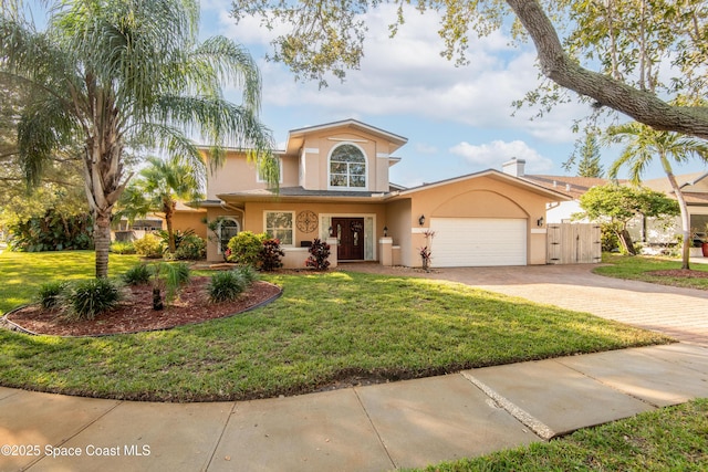 view of front of home featuring a garage and a front lawn