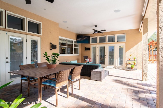 view of patio with outdoor lounge area, french doors, and ceiling fan