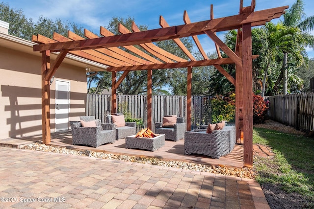 view of patio featuring a pergola and an outdoor living space with a fire pit