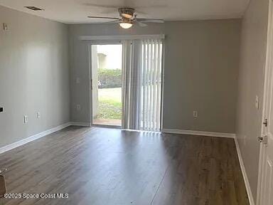 empty room featuring ceiling fan and dark hardwood / wood-style floors