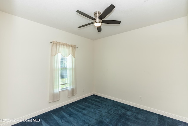 spare room featuring carpet flooring and ceiling fan