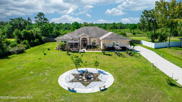 rear view of property with a lawn