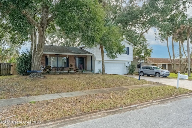 view of front of property featuring a garage and a porch