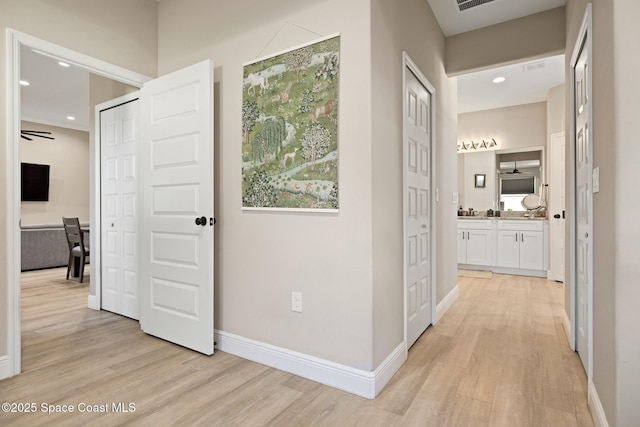 hall featuring light hardwood / wood-style flooring