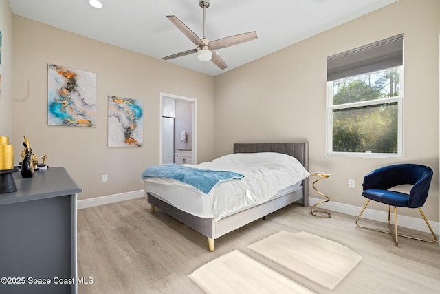 bedroom with ceiling fan, light hardwood / wood-style flooring, and ensuite bathroom