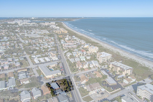 birds eye view of property with a beach view and a water view