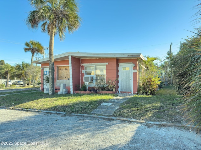 view of outbuilding with a yard