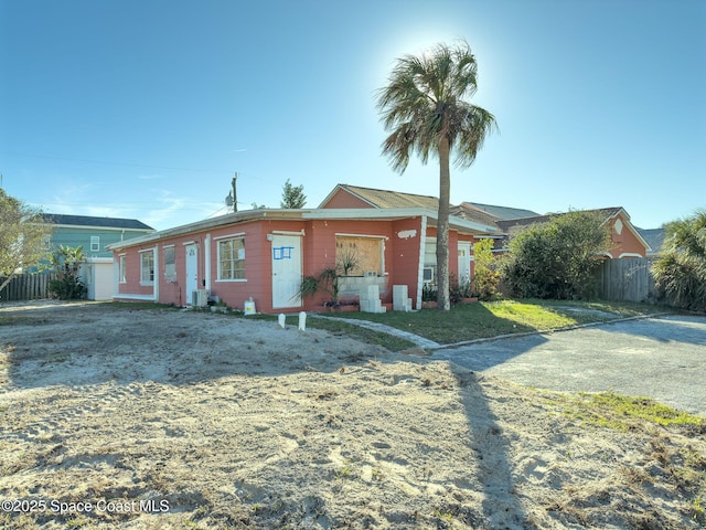 ranch-style home with central AC